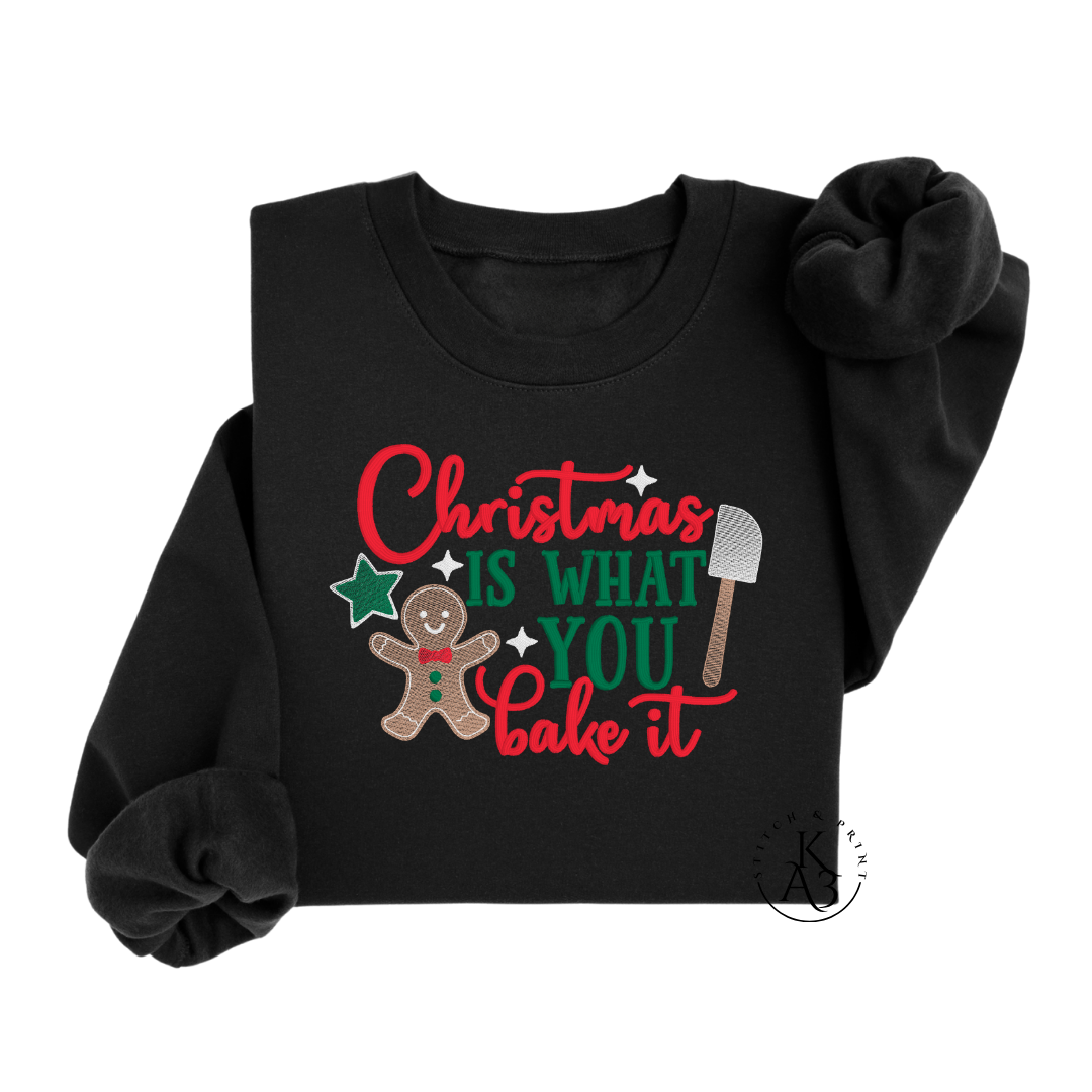 Black sweatshirt with Christmas-themed design featuring a gingerbread man and text on a white background.