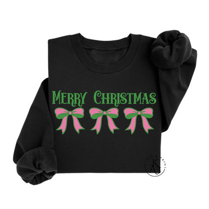 Black sweatshirt with embroidered 'Merry Christmas' and pink and green bow designs on a white background