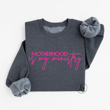 Personalized Dark Grey sweatshirt with pink text embroidered "Motherhood is my ministry"