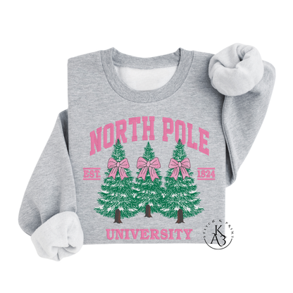 Gray sweatshirt with 'North Pole University' text and Christmas tree design on a white background