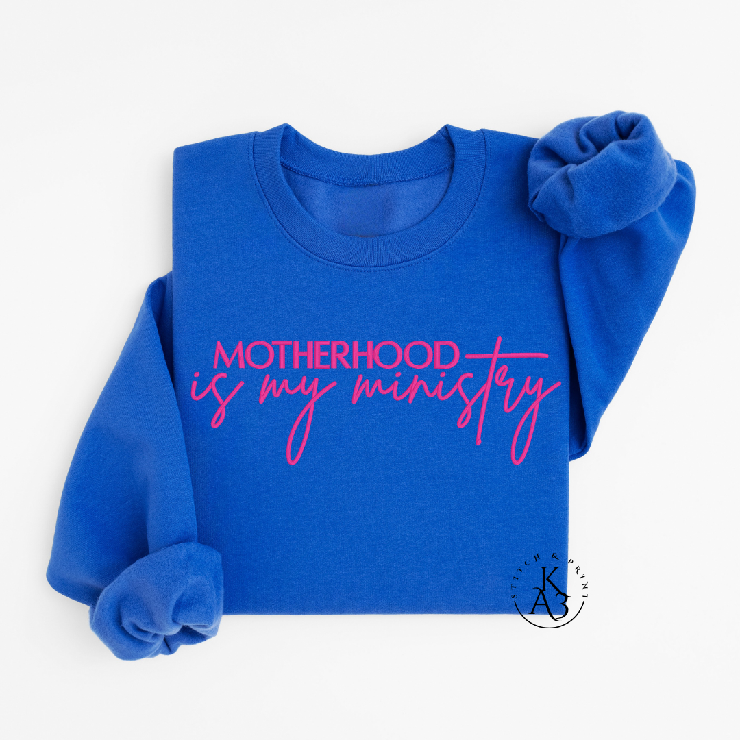 Personalized Royal Blue sweatshirt with pink text embroidered "Motherhood is my ministry"