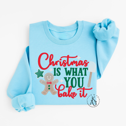 Light blue sweatshirt with Christmas-themed text and graphics on a white background