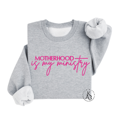 Personalized Sport Grey sweatshirt with pink text embroidered "Motherhood is my ministry"