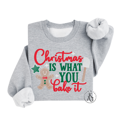 Gray sweatshirt with Christmas-themed text and graphics on a white background
