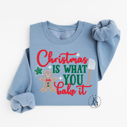 Light blue sweatshirt with Christmas-themed text and graphics on a white background