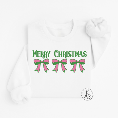 White Sweatshirt with an embroidered 'Merry Christmas' text with pink and green bows on a white background