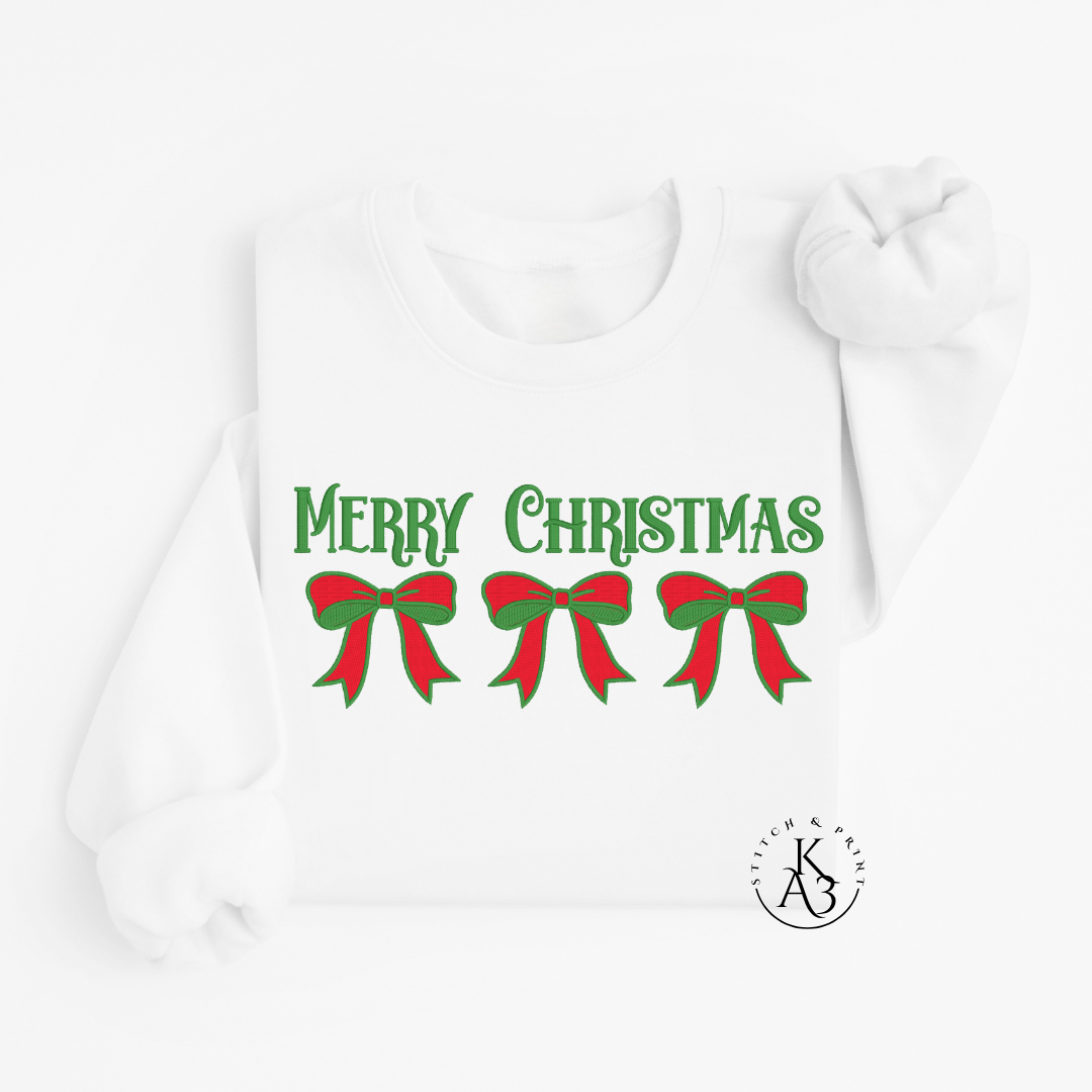 White Sweatshirt with embroidered 'Merry Christmas' text and red and green bows on a white background